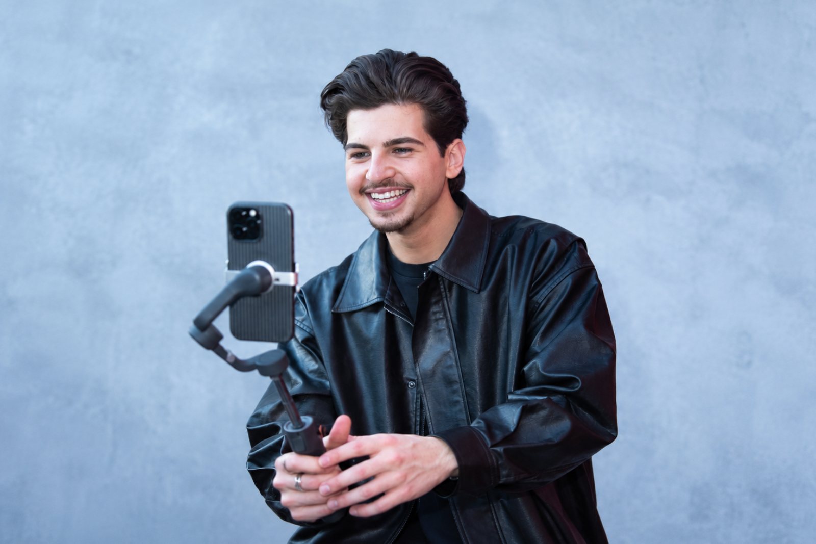Joseph Rako filming short-form video on a gimbal during a client shoot day
